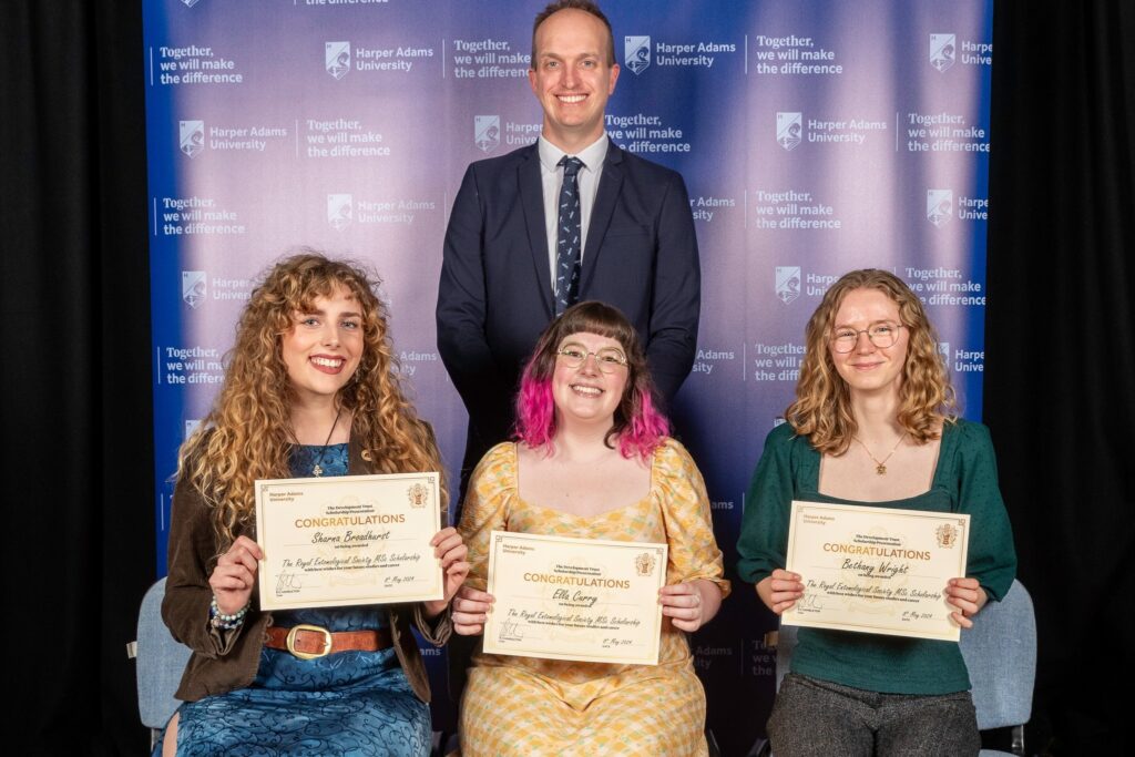 RES CEO Simon Ward with students Sharna Broadhurst, Ella Curry and Bethany Wright at the Harper Adams University awards ceremony, holding certificates of congratulations on their RES MSc scholarships. 