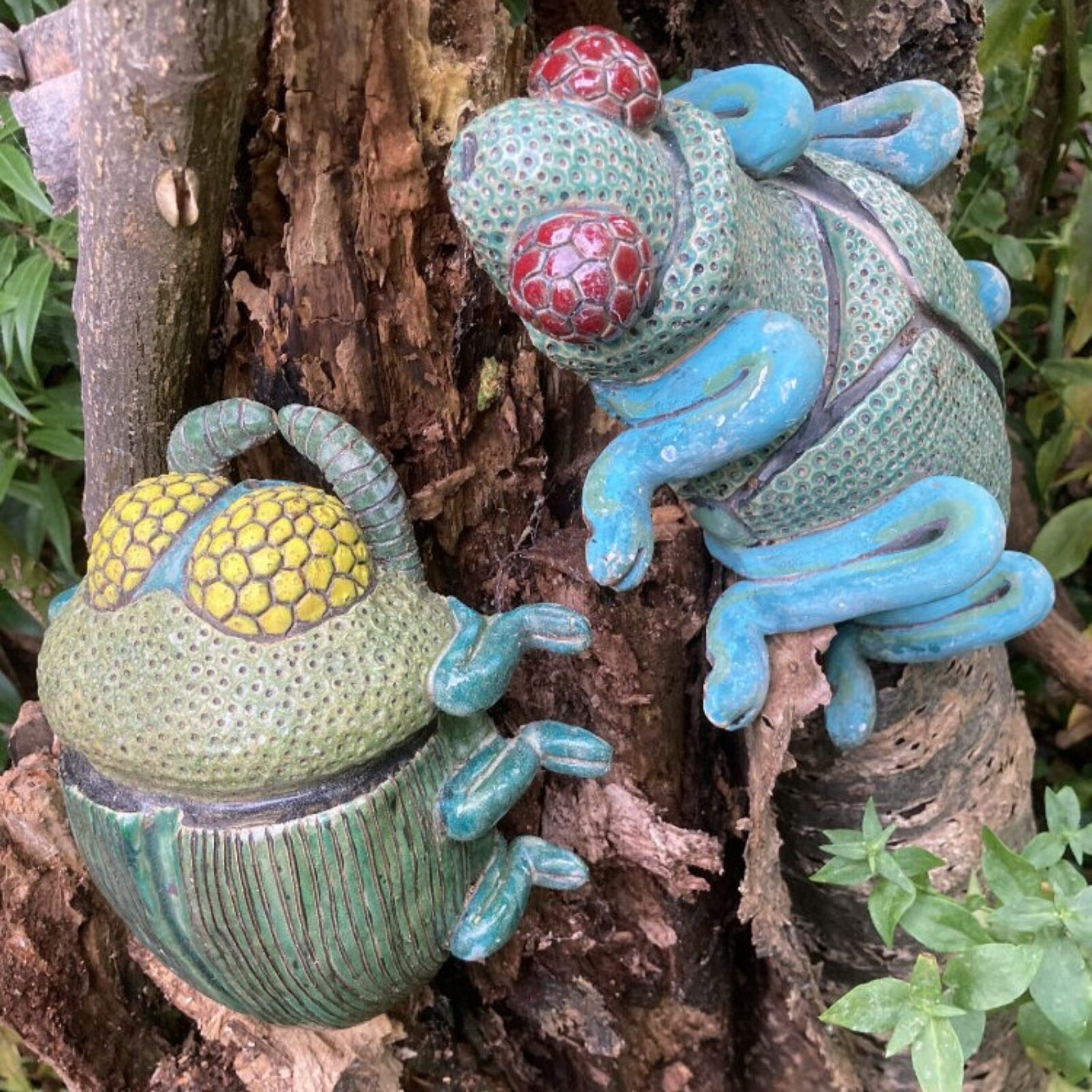 Ceramic wood boring beetles on a cherry tree stump. Created by Veronica Cosier, winner of the ’18 and over’ category