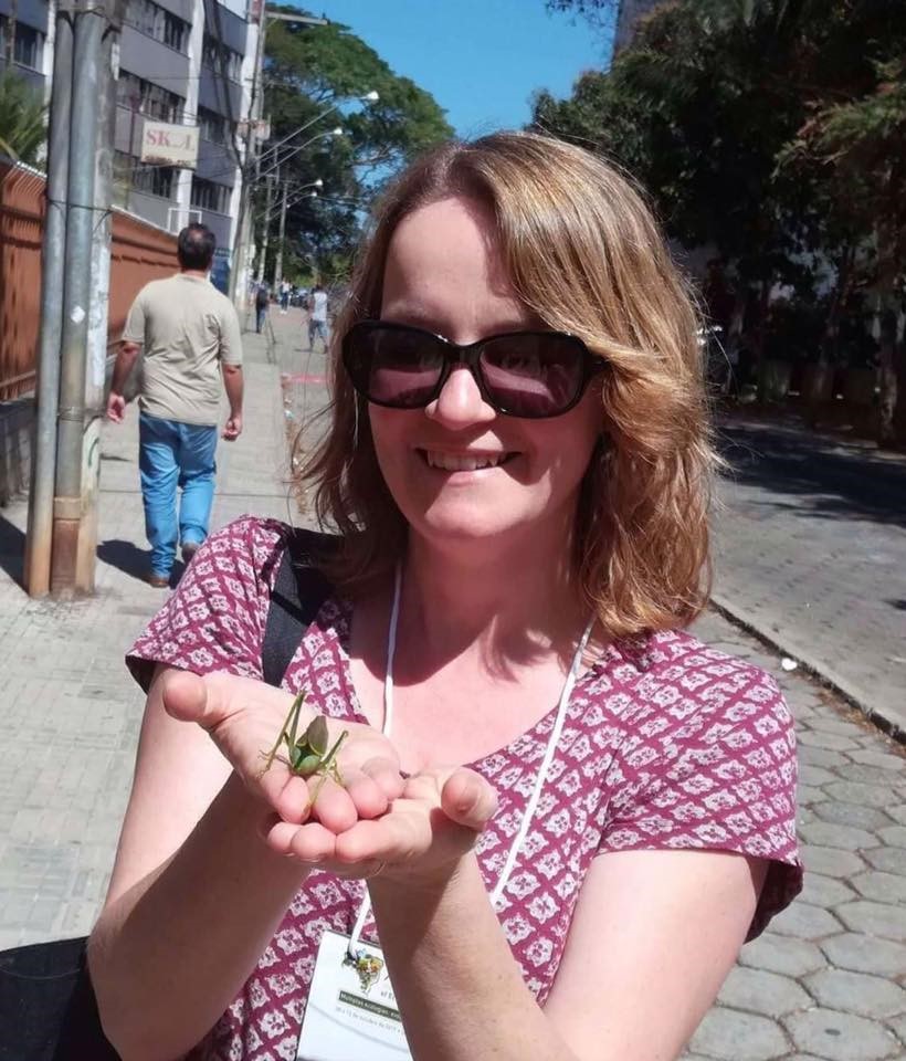 Sheena Cotter, Editor-in-Chief of RES journal Ecological Entomology holding an insect